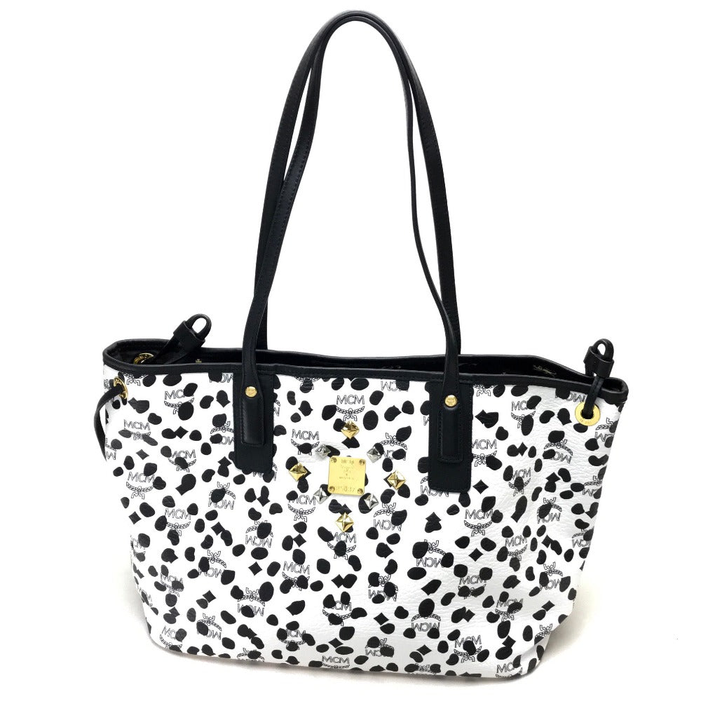 MCM LOVELESS collaboration Dalmatian studded shoulder bag/tote bag in coated leather, available in white and black.