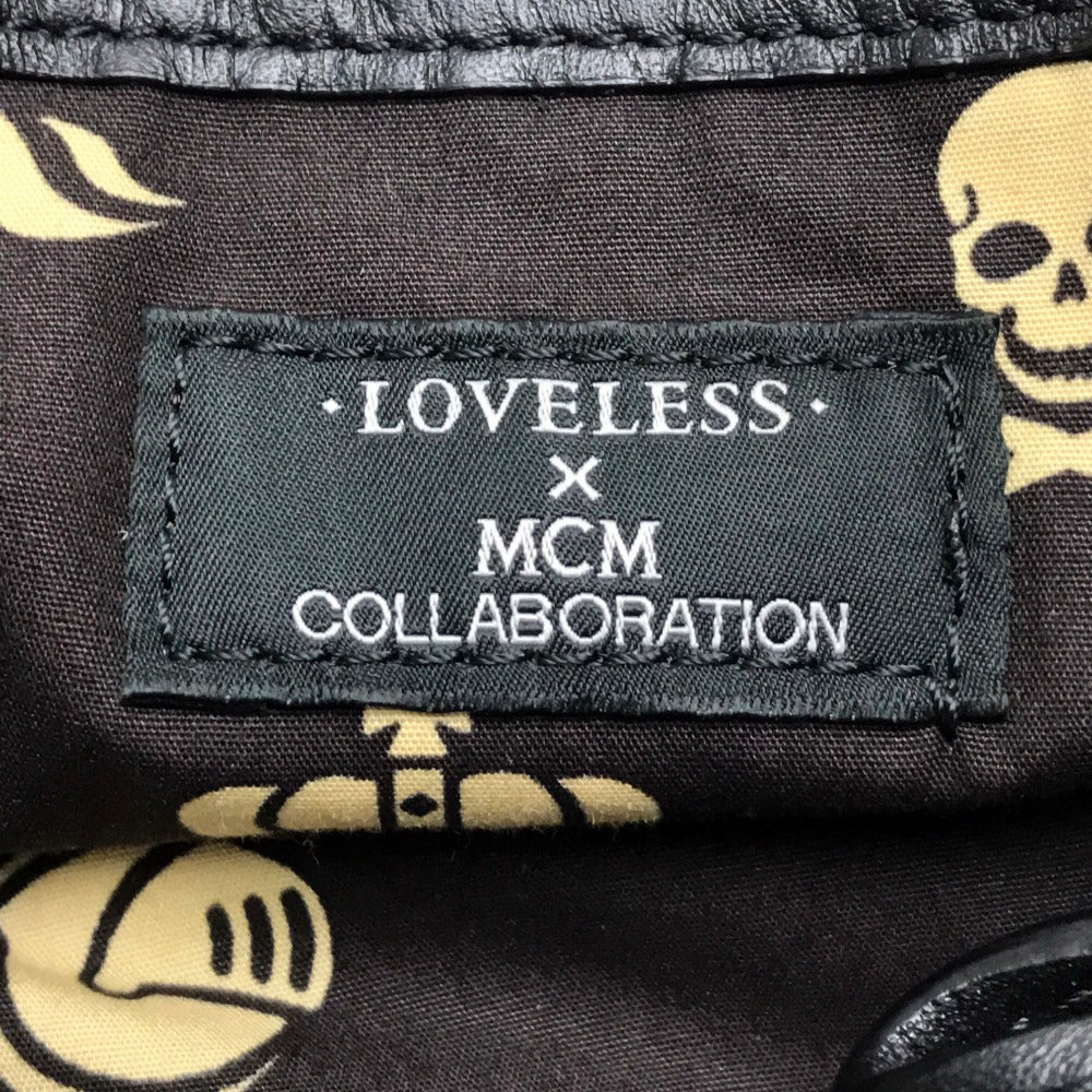 MCM LOVELESS collaboration Dalmatian studded shoulder bag/tote bag in coated leather, available in white and black.