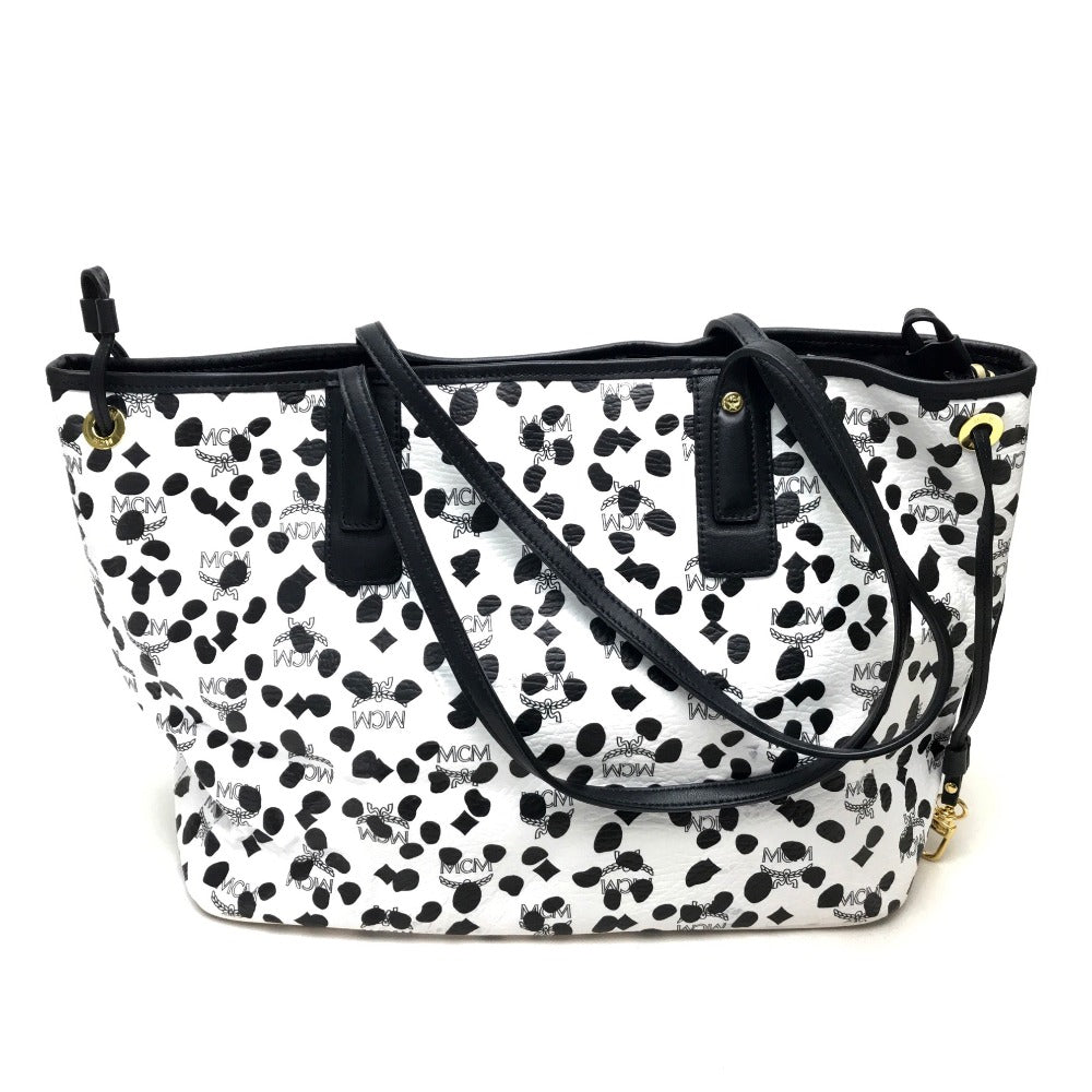 MCM LOVELESS collaboration Dalmatian studded shoulder bag/tote bag in coated leather, available in white and black.