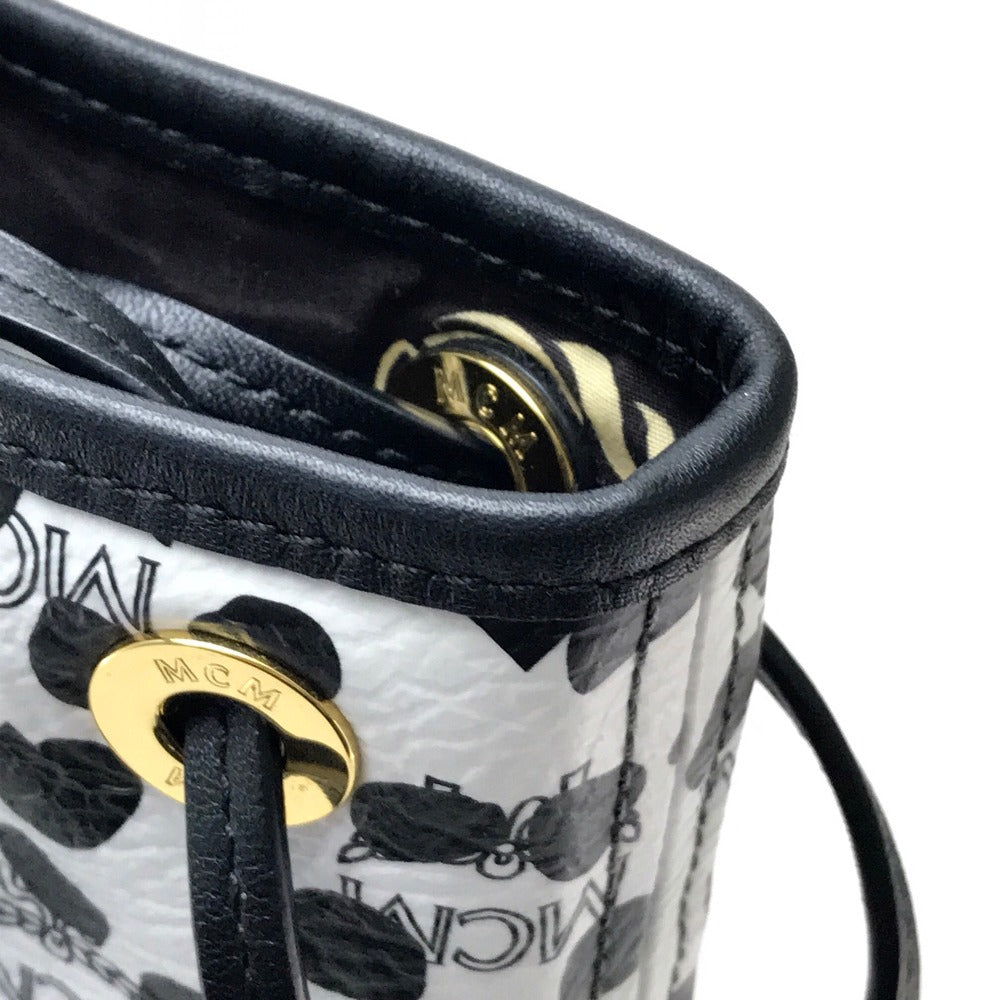 MCM LOVELESS collaboration Dalmatian studded shoulder bag/tote bag in coated leather, available in white and black.