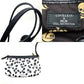 MCM LOVELESS collaboration Dalmatian studded shoulder bag/tote bag in coated leather, available in white and black.