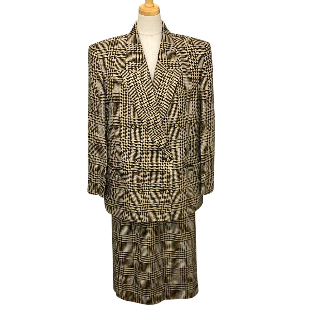 Burberrys Overall handle Suit set (jacket and skirt) with double-breasted jacket and skirt in a houndstooth pattern. Apparel. setup cotton Brown Used