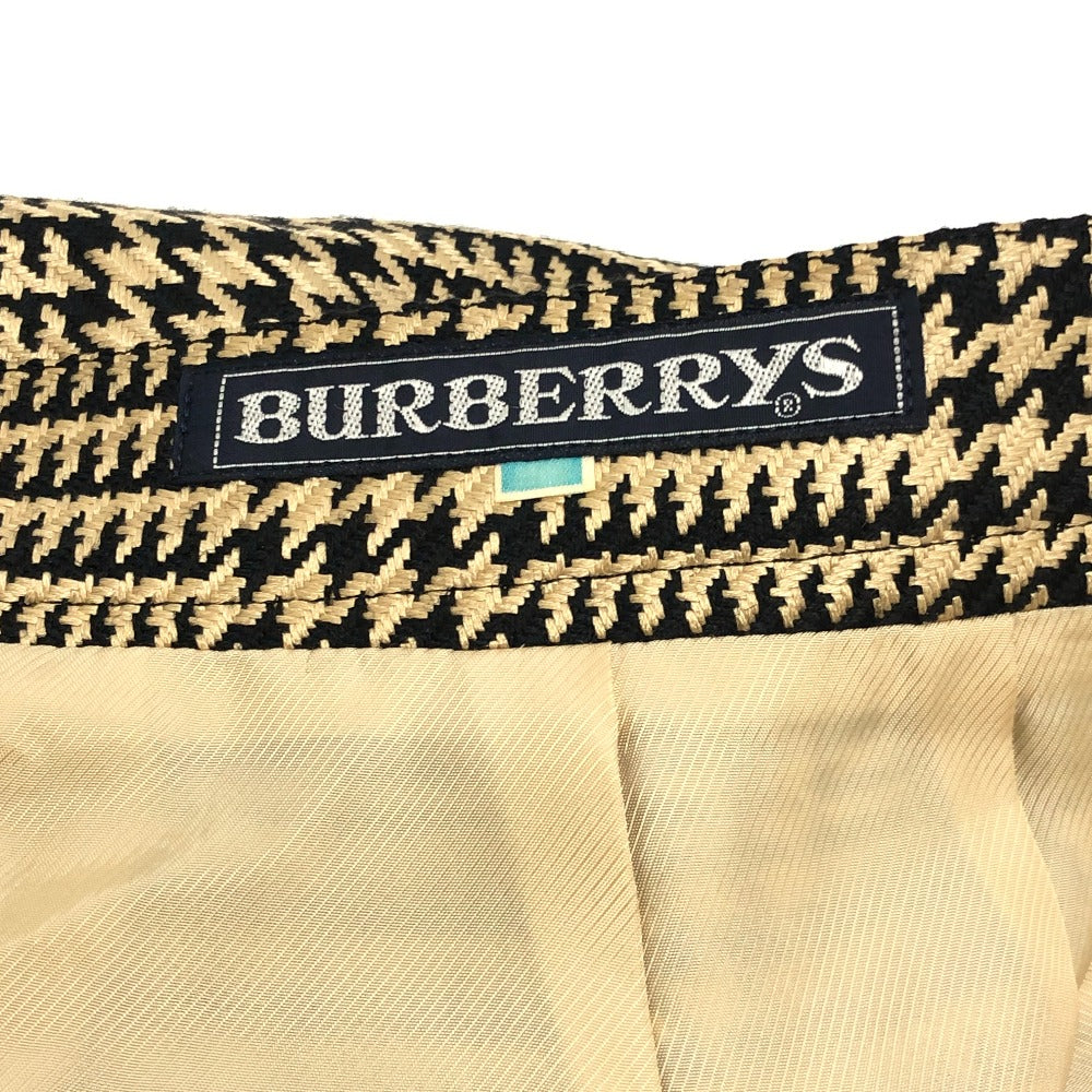Burberrys Overall handle Suit set (jacket and skirt) with double-breasted jacket and skirt in a houndstooth pattern. Apparel. setup cotton Brown Used