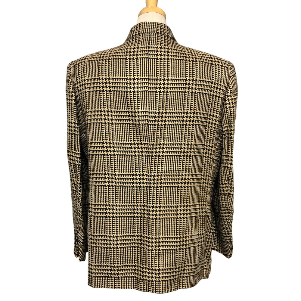 Burberrys Overall handle Suit set (jacket and skirt) with double-breasted jacket and skirt in a houndstooth pattern. Apparel. setup cotton Brown Used