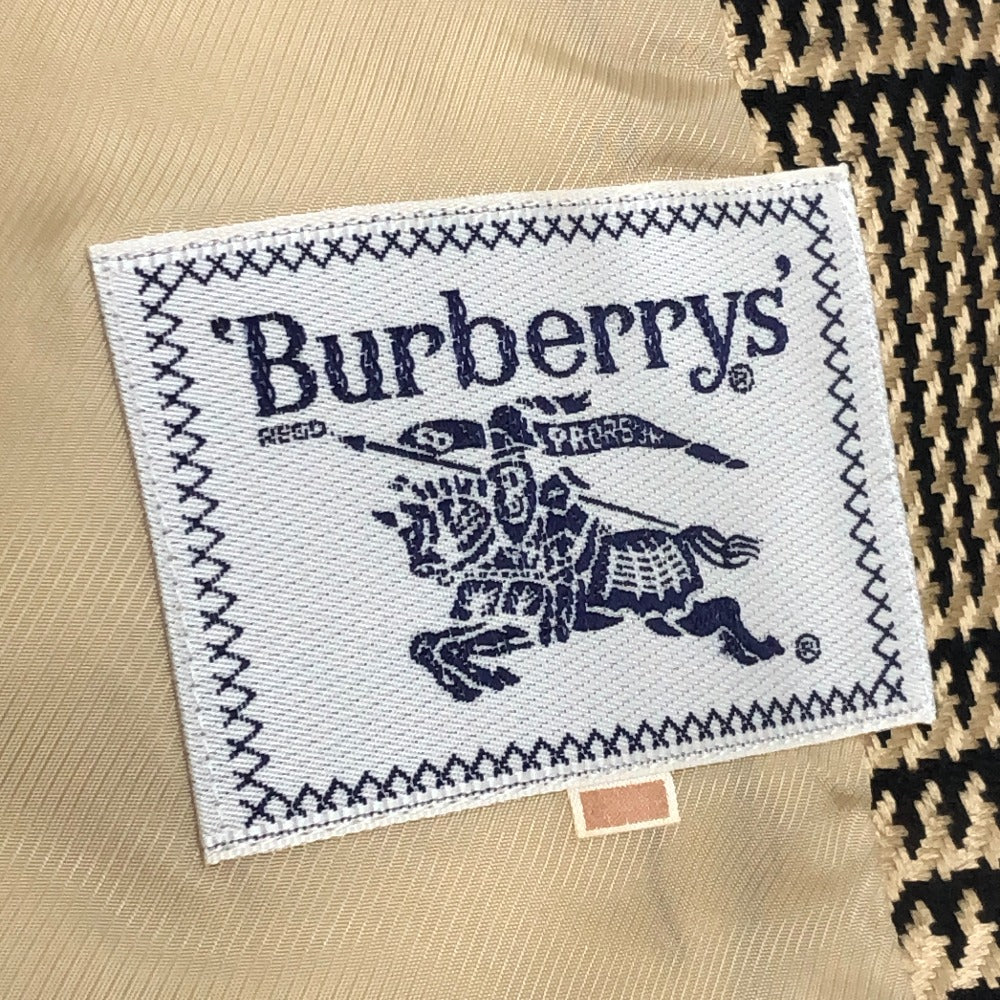 Burberrys Overall handle Suit set (jacket and skirt) with double-breasted jacket and skirt in a houndstooth pattern. Apparel. setup cotton Brown Used