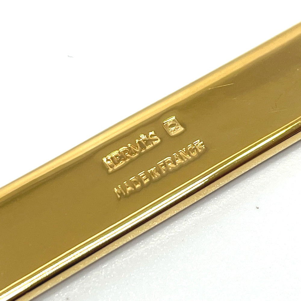 HERMES Takayaki enamel pintuck brooch in gold, metal, for women.