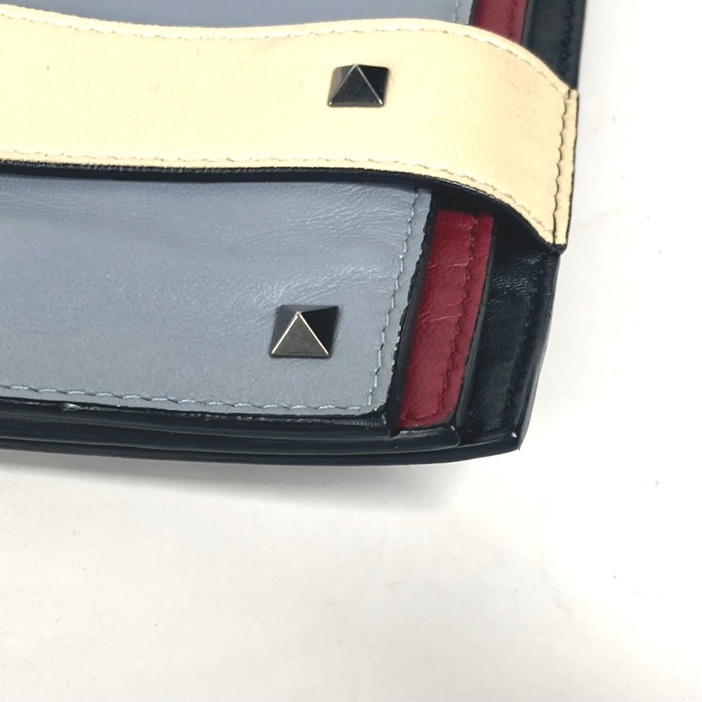 VALENTINO studded triple clutch bag in black leather, tricolor design.