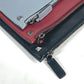 VALENTINO studded triple clutch bag in black leather, tricolor design.