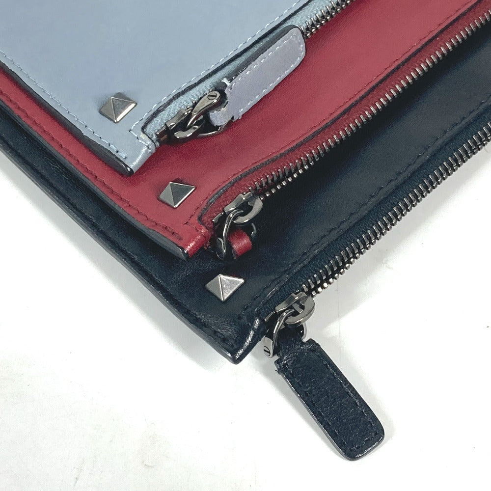 VALENTINO studded triple clutch bag in black leather, tricolor design.