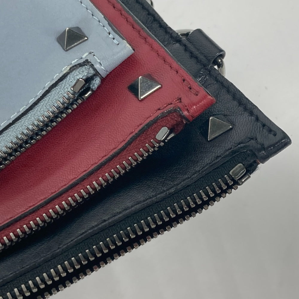 VALENTINO studded triple clutch bag in black leather, tricolor design.