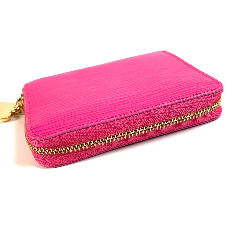 LOUIS VUITTON M14144 Japan-exclusive Epi Leather Zippy Coin Purse by Takashi Murakami. This wallet features a round zipper and is crafted from Epi leather. It's a cute pink design.