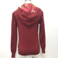 HERMES all-over print hooded knit top with silk accents, cashmere, and a cashmere-blend jacket. Available in red and yellow.