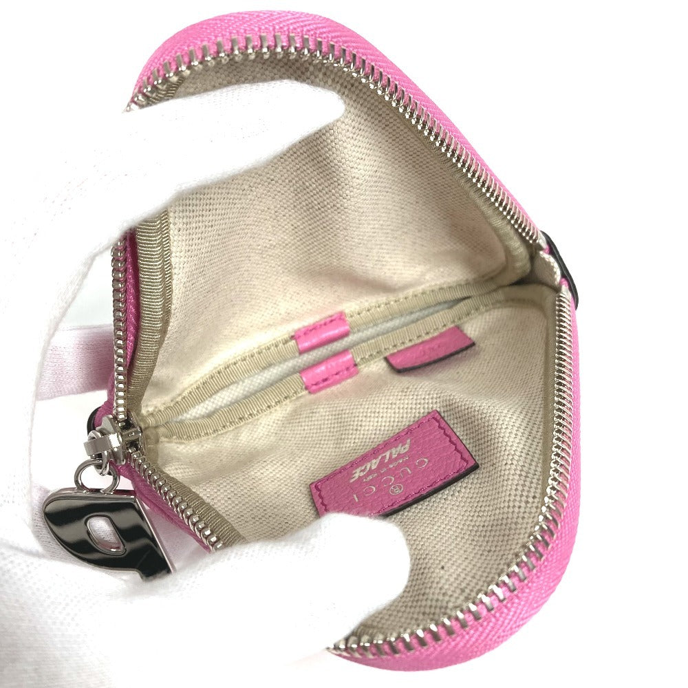 GUCCI Palace GG Supreme logo wallet with zip-around closure, coin purse, and multi-purpose pouch in GG Supreme canvas. Unisex, pink. 723144