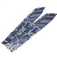 HERMES Apron d'Or, a silk scarf with a ruffled twilly lining, available in Marine Foncé, black, white, and blue.