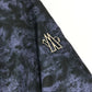 MONCLER EBONY GIUBBOTTO EBONY JACKET, featuring a metal logo and all-over print. This long-sleeved polyester down jacket is perfect for women and features a navy blue interior.
