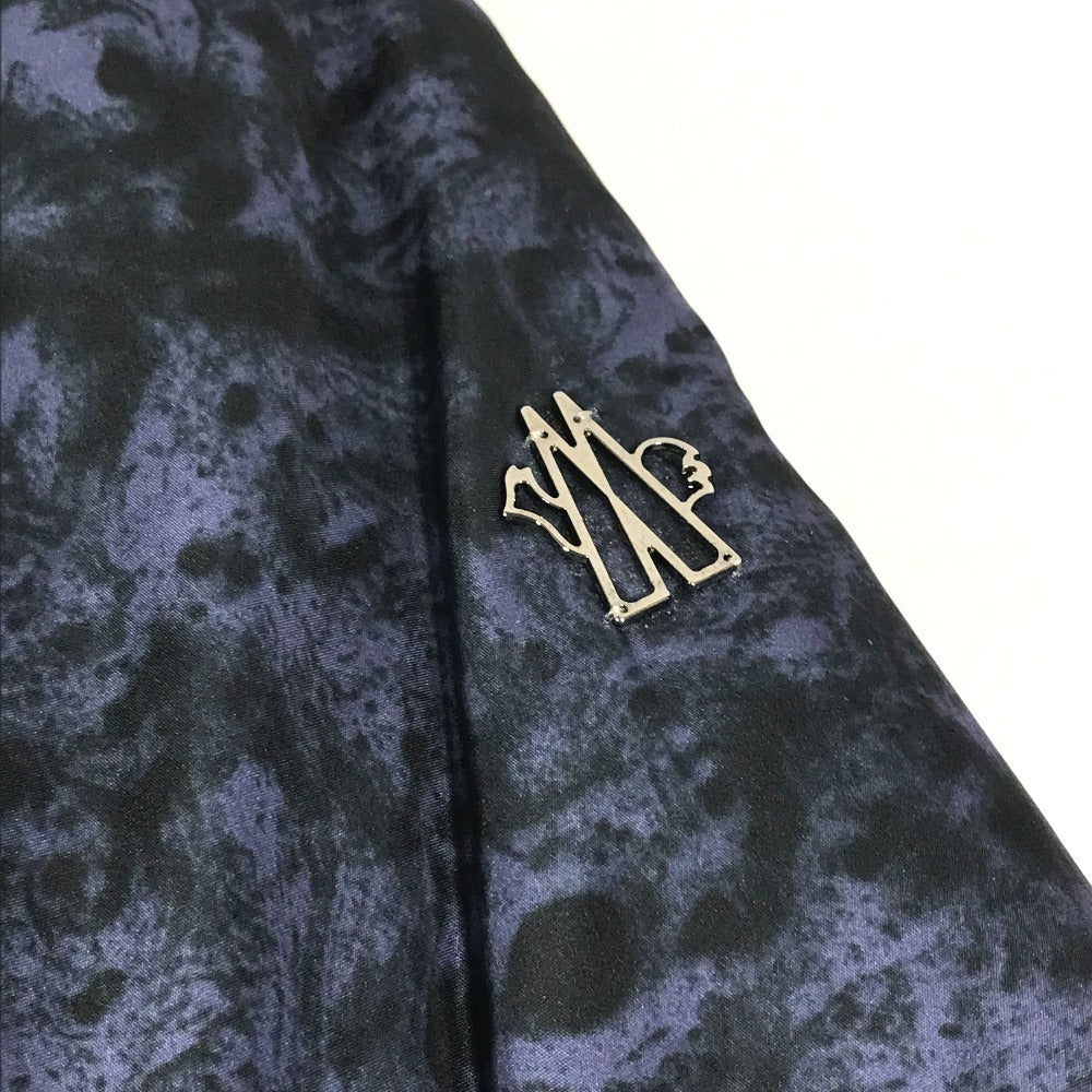 MONCLER EBONY GIUBBOTTO EBONY JACKET, featuring a metal logo and all-over print. This long-sleeved polyester down jacket is perfect for women and features a navy blue interior.