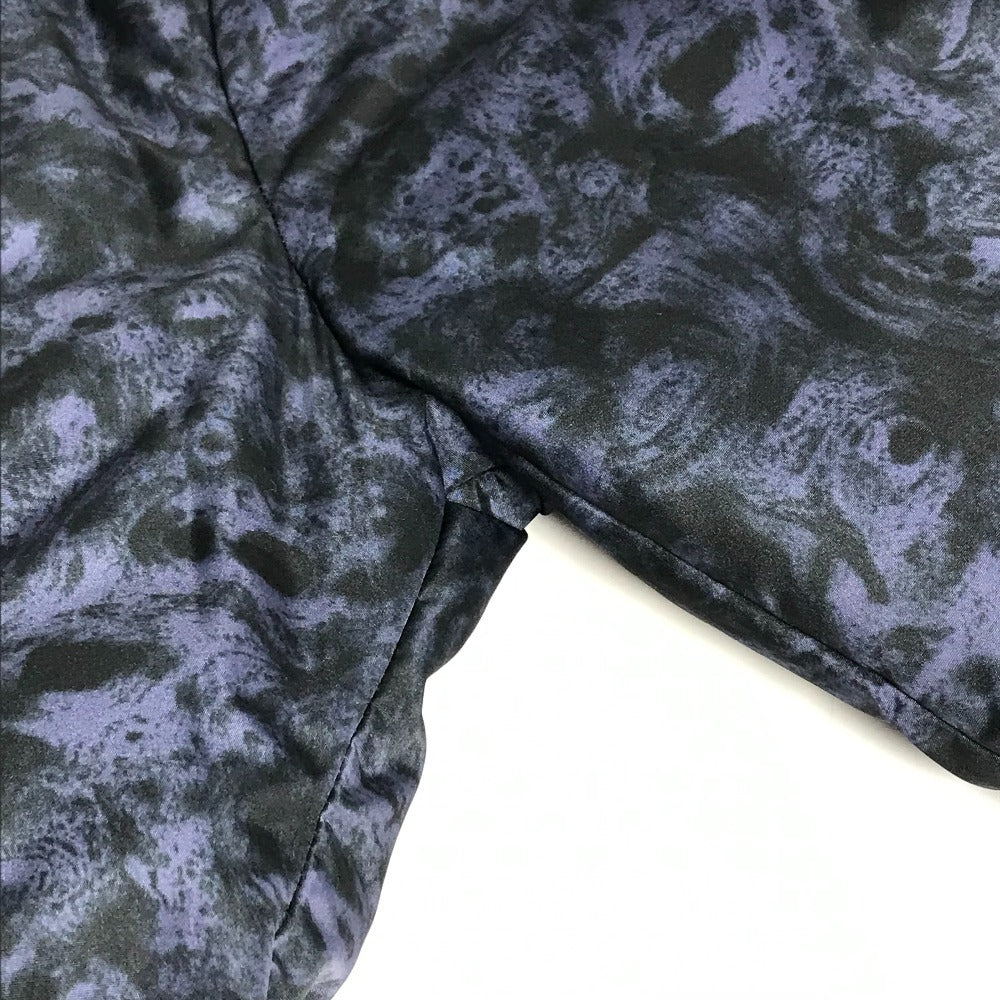 MONCLER EBONY GIUBBOTTO EBONY JACKET, featuring a metal logo and all-over print. This long-sleeved polyester down jacket is perfect for women and features a navy blue interior.