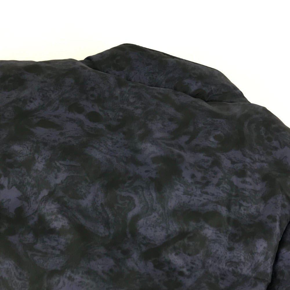 MONCLER EBONY GIUBBOTTO EBONY JACKET, featuring a metal logo and all-over print. This long-sleeved polyester down jacket is perfect for women and features a navy blue interior.