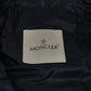 MONCLER EBONY GIUBBOTTO EBONY JACKET, featuring a metal logo and all-over print. This long-sleeved polyester down jacket is perfect for women and features a navy blue interior.