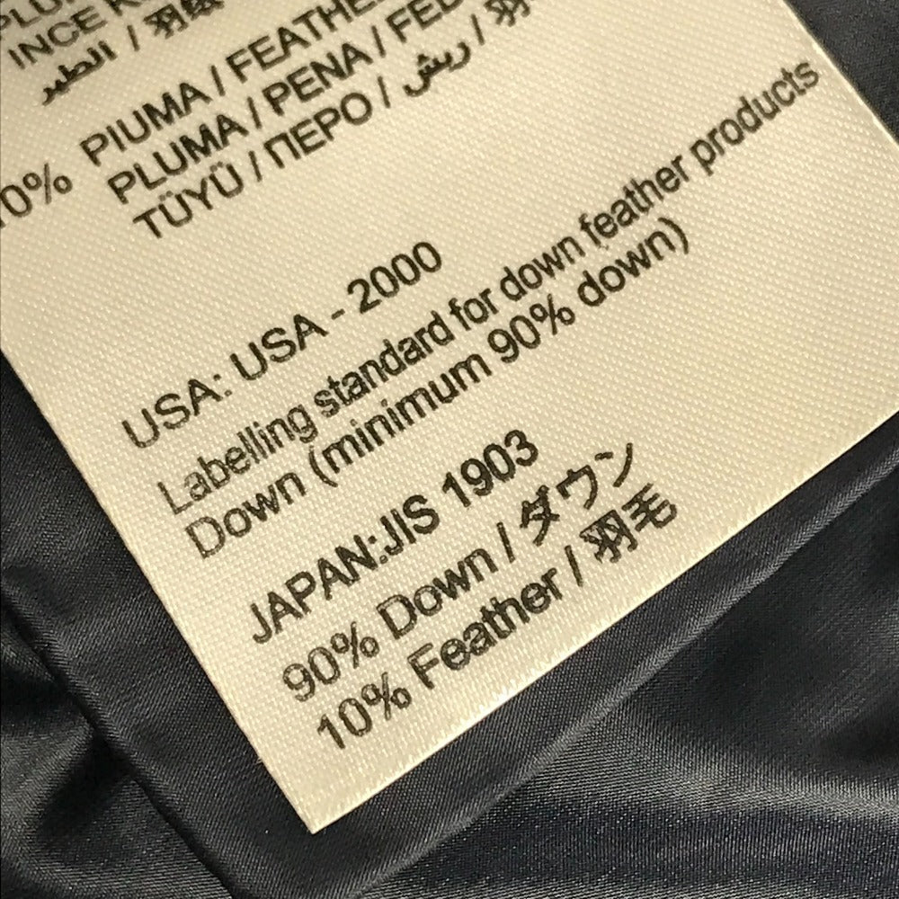 MONCLER EBONY GIUBBOTTO EBONY JACKET, featuring a metal logo and all-over print. This long-sleeved polyester down jacket is perfect for women and features a navy blue interior.