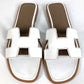 HERMES Oran H-Logo รองเท้าแตะแฟลตหนังสีขาวสำหรับผู้หญิง