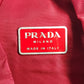 PRADA กระเป๋าเป้สะพายหลังโลโก้สามเหลี่ยมทูโทน กระเป๋าเป้สะพายหลังผ้าไนลอน unisex สีแดง
