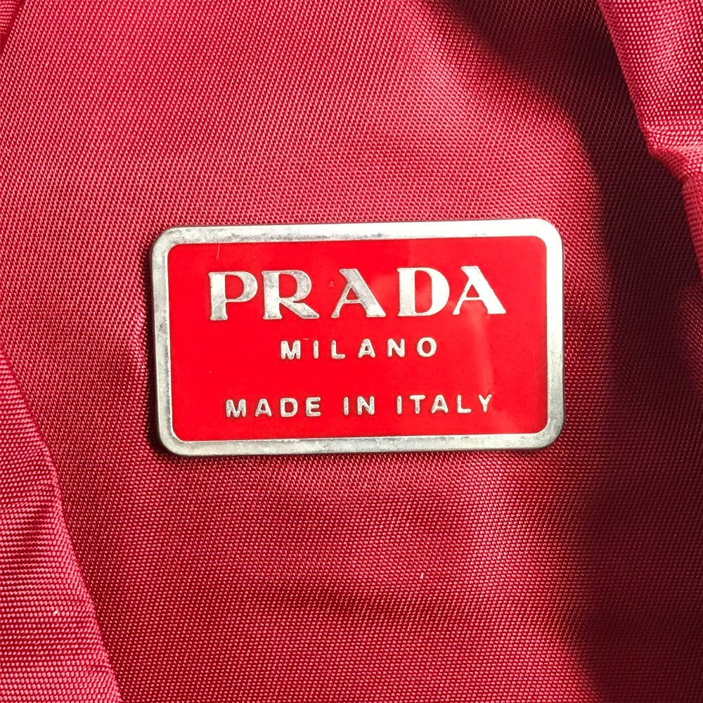 PRADA กระเป๋าเป้สะพายหลังโลโก้สามเหลี่ยมทูโทน กระเป๋าเป้สะพายหลังผ้าไนลอน unisex สีแดง