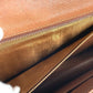 LOUIS VUITTON M51810 Monogram Pochette Dame GM. This unisex Monogram canvas Pochette Dame GM clutch bag is perfect as a pouch or second bag. It's brown and unisex.
