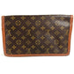 LOUIS VUITTON M51810 Monogram Pochette Dame GM. This unisex Monogram canvas Pochette Dame GM clutch bag is perfect as a pouch or second bag. It's brown and unisex.