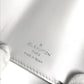 LOUIS VUITTON M67621 Taiga Rama Discovery Compact Wallet, a tri-fold wallet in Taiga leather, unisex, in blanc and white.