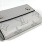 LOUIS VUITTON M67621 Taiga Rama Discovery Compact Wallet, a tri-fold wallet in Taiga leather, unisex, in blanc and white.