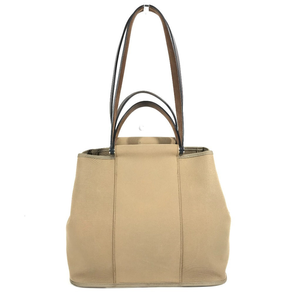 HERMES Cabag PM, a handbag/shoulder bag in brown leather/canvas.