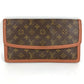 LOUIS VUITTON M51810 Monogram Pochette Dame GM. This unisex Monogram canvas Pochette Dame GM clutch bag is perfect as a pouch or second bag. It's brown and unisex.