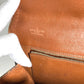 LOUIS VUITTON M51810 Monogram Pochette Dame GM. This unisex Monogram canvas Pochette Dame GM clutch bag is perfect as a pouch or second bag. It's brown and unisex.