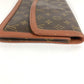LOUIS VUITTON M51810 Monogram Pochette Dame GM. This unisex Monogram canvas Pochette Dame GM clutch bag is perfect as a pouch or second bag. It's brown and unisex.