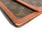 LOUIS VUITTON M51810 Monogram Pochette Dame GM. This unisex Monogram canvas Pochette Dame GM clutch bag is perfect as a pouch or second bag. It's brown and unisex.